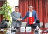 baidu09欧健集团与国内医疗保健公司国药集团签约